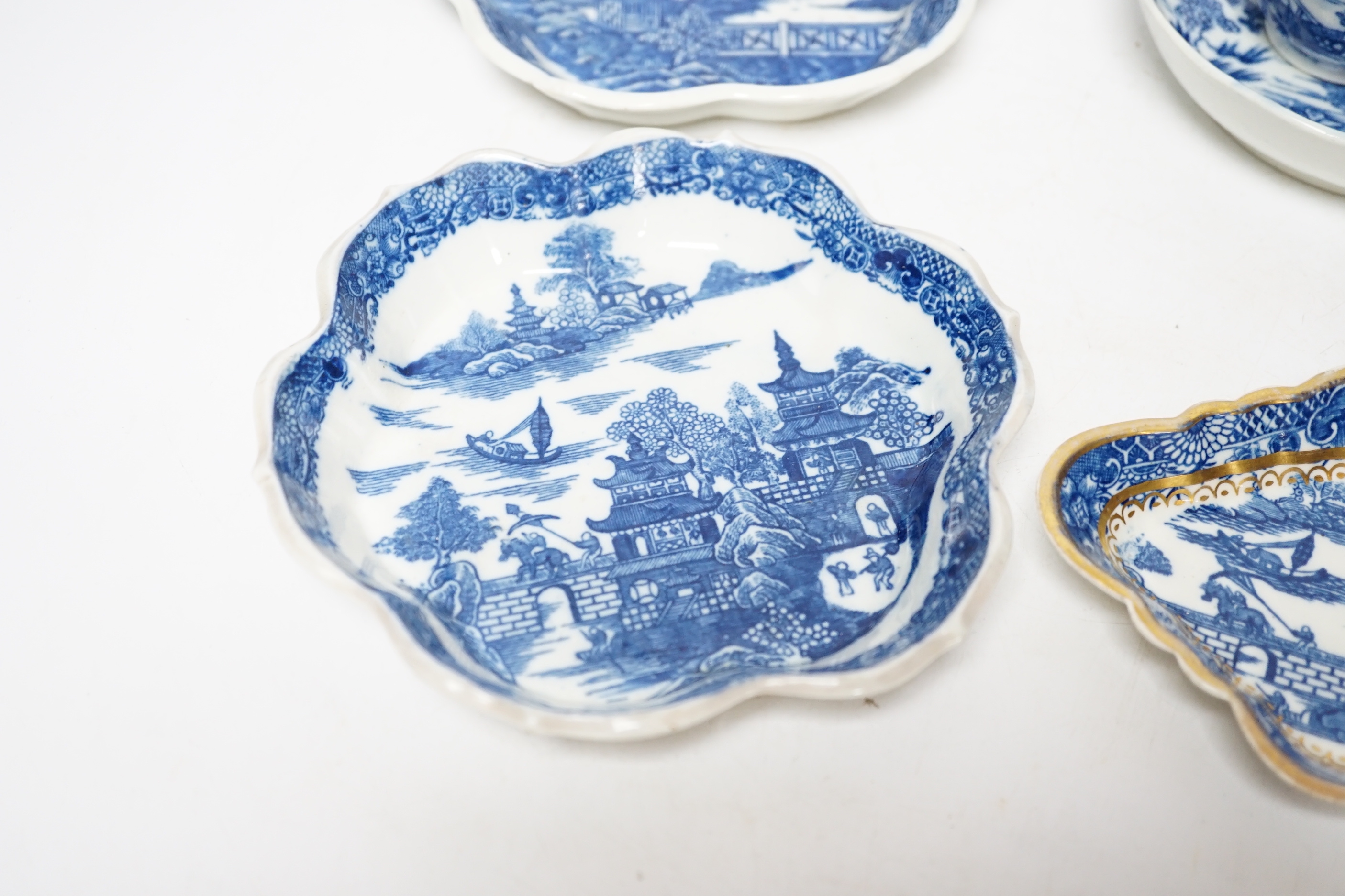 A group of Caughley pagoda pattern table wares, late 18th century, including two teapot stands, a coffee cup and saucer and a spoon tray